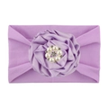 Close-up of light purple nylon baby headband with satin flower and rhinestone center - Purple