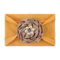 Detail of baby nylon headband featuring a large dusty pink fabric rose and faux pearl center - Orange