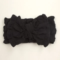 Detail of a large black bow headband with elastic wrinkled fabric for babies and toddlers - Black