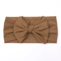 Detailed macro view of the soft mesh texture and large bow on this brown baby headband - Dark Coffee