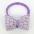 Detailed view of baby purple headband featuring a cute lilac gingham bow design - Purple