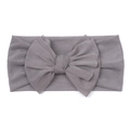 Close-up detail of soft greyish purple mesh fabric and bow knot on baby headband - Gray