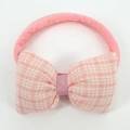 Detailed view of baby nylon headband featuring a large pink and white checkered bow - Pink