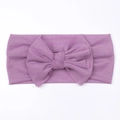 Close-up detail of soft purple mesh baby headband with a large bow for infants - Purple