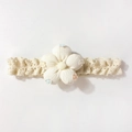 Detailed close-up of beige infant lace headband with floral cotton embroidery - White
