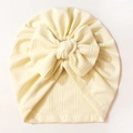 Turbante neonato in maglia a righe color panna con un grande fiocco decorativo - Beige