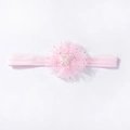 Detail van de roze babyhaarband met tule bloem en glinsterende ster in het midden - Roze