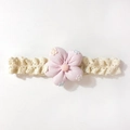 Close-up of soft lace baby headband with large pink 3D fabric flower and embroidery - Pink