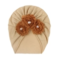 Detail of baby turban hat with three brown fabric flowers and pearls on beige knit fabric - Light Coffee