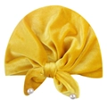 Soft yellow velvet baby turban hat with a large decorative bow and elegant pearl accents - Yellow