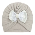 Detail of grey baby turban with elegant lace bow, ribbon, and pearl accents - Gray