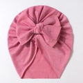 Detail of rose pink baby turban hat featuring a large double bow and pleated cotton texture - Dust Rose