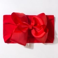 Detailed close-up of vibrant red baby headband with a large textured grosgrain ribbon bow - Red