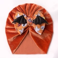 Halloween baby turban hat with orange velvet fabric, bat wings and pumpkin bow detail - Orange