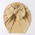 Detail of baby turban hat in khaki ribbed fabric featuring a large decorative bow tie - Light Coffee