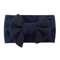 Detail view of baby bow headband showing waffle texture and soft black elastic fabric - Black