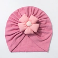 Detail of pink knitted baby hat with handmade fabric flower and double stitching - Dust Rose