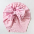Detail of soft pink ribbed knit baby hat featuring a large layered chiffon bow decoration - Pink