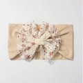 Detail of baby nylon headband featuring floral lace bow and soft knitted beige texture - Beige Coffee