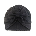 Detailed view of black knitted baby turban hat with soft herringbone pattern and large bow - Black