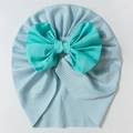 Detailed view of soft ribbed knit baby turban hat featuring a large turquoise bow accent - Blue