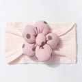 Detail of soft pink ribbed baby headband with large brown polka dot fabric flower accessory - Light Pink