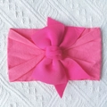 Detailed top view of soft pink nylon baby headband with a large layered bow knot - Rose Red