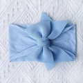 Detail of soft light blue nylon baby headband featuring a large knitted bow for infants - Light Purple