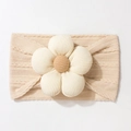 Detailed view of beige knitted baby headband featuring a soft 3D corduroy flower - Beige Coffee