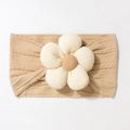 Close-up of khaki knitted baby headband with a 3D floral accent and soft cable weave - Light Coffee