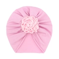 Detailed view of light pink baby turban hat with elegant layered satin flower ornament - Pink