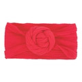 Dettaglio della fascia per neonati in nylon rosso con un grande nodo a fiore morbido - Rosso