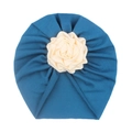 Detail of teal baby turban hat featuring a cream 3D fabric flower and soft pleated fabric - Navy Blue