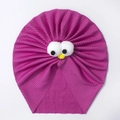 Détail d'un bonnet turban bébé violet côtelé avec des yeux de dessin animé en relief - Fuchsia