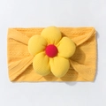 Detailed knit texture of baby yellow headband with a 3D flower and red center - Earthy Yellow