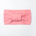 Detailed view of pink ribbed elastic nylon headband with a cute knotted bow for babies - Dust Rose