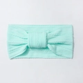 Detailed knit texture and knot bow design on a stretchy mint green baby nylon headband - Mint Green