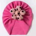 Close-up of bright pink baby turban hat with light pink heart-patterned fabric flower - Rose Red