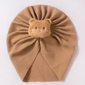 Brown waffle cotton baby hat featuring a cute plush bear ornament on a white background - Coffee