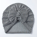 Macro view of newborn striped baby turban showing fabric texture and a large bow tie - Black and White