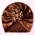 Detail of baby velvet turban hat in dark brown with a large polka dot floral knot - Brown