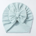 Detailed view of mint green striped newborn hat featuring a large soft knit bow - Light Green