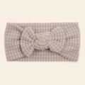 Close-up of light grey baby headband with textured bubble waffle fabric and large bow - Gray