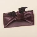 Detail of soft purple velvet baby headband featuring black Halloween bat wings decoration - Taro Purple