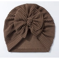 Detailed view of chocolate brown ribbed baby turban hat with a large decorative bow - Brown