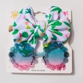 Detail of baby headband with cactus print and floral sunglasses set on card packaging - Green (Cactus Pattern)