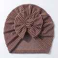 Detailed close-up of brown and beige striped newborn beanie with large bow knot - Red Brown