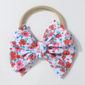 Detail of floral printed ribbed bow on soft stretch nylon baby headband accessory - White Base Floral Print Style / Rose Red