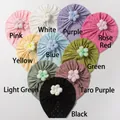 Macro detail of baby knot hats featuring hollow lace fabric and 3D floral decorations - 10 Colors Mixed
