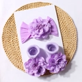 Detailed view of baby headbands and socks set featuring large purple 3D fabric flowers - Purple